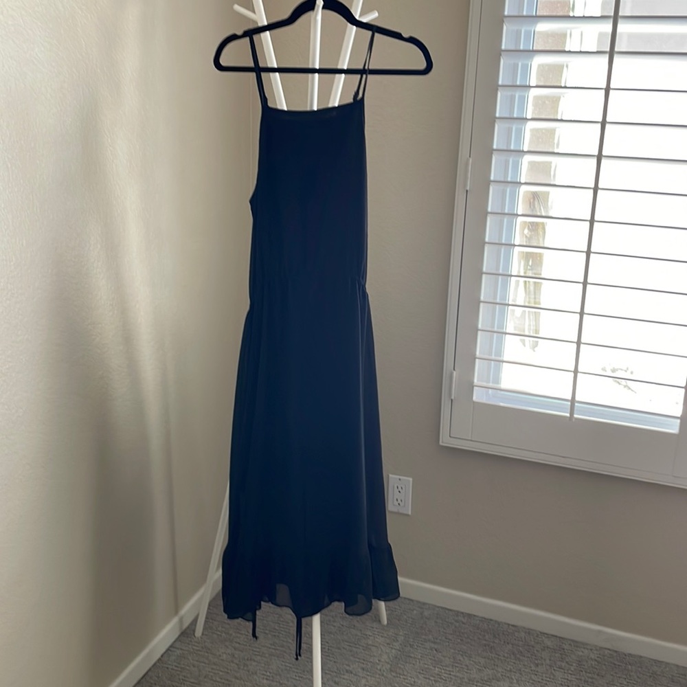 Absolutely beautiful summer dress. Lightweight with cute side rushing details